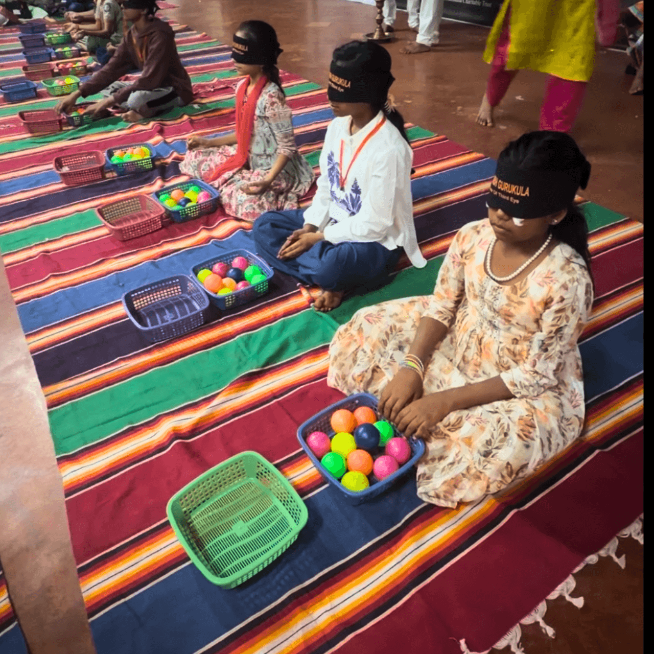 A child attempting a blindfold activity