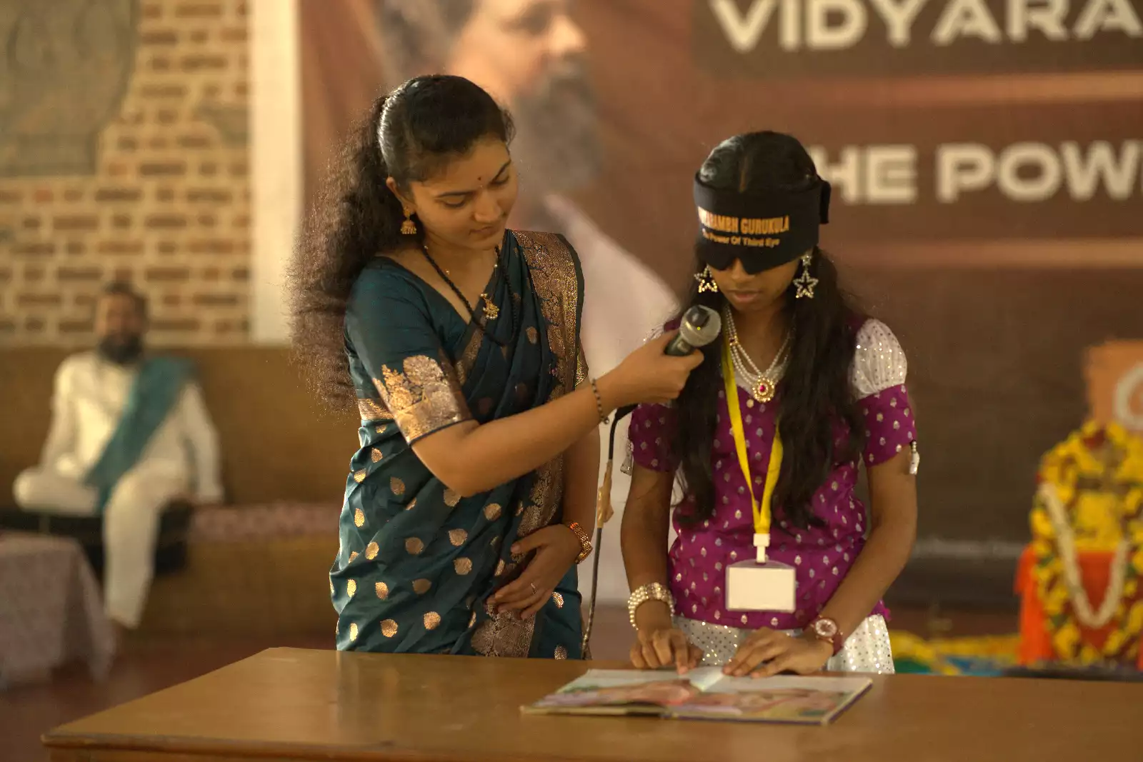 A child reading with the blindfold on